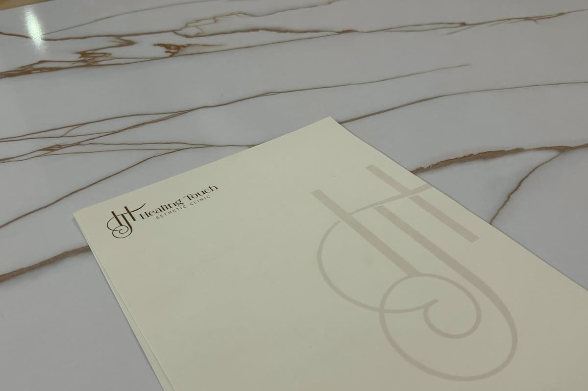 Healing Touch letterhead resting on a marble surface